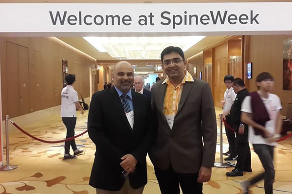 dr sunny shethna performing spine surgery in surat, gujarat